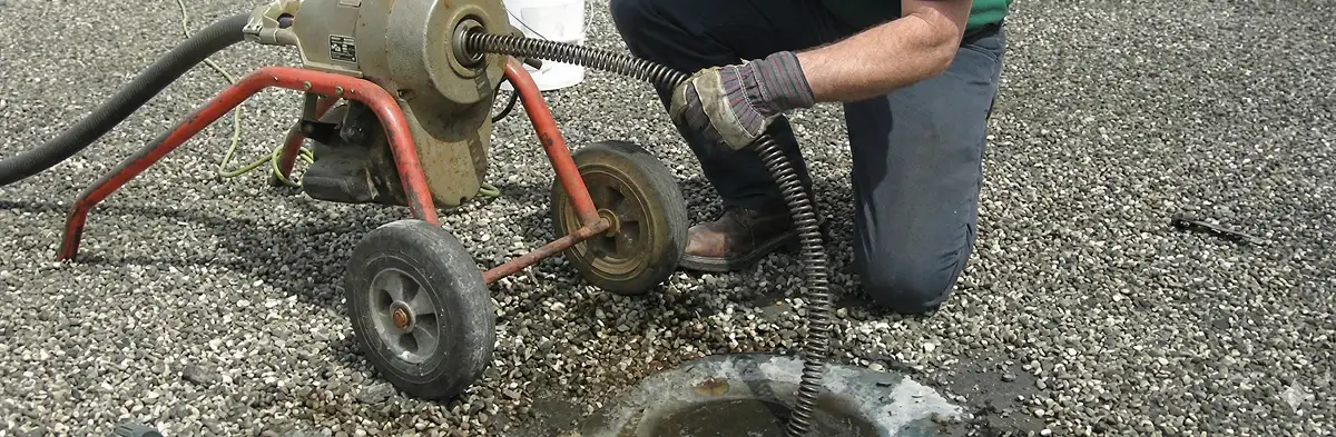sewer rodding technician actively removing blockages from a sewer line in Fort Collins, CO