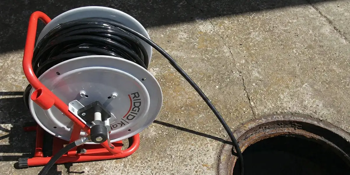 sewer rodding equipment prepared to clear clogged sewer lines in Fort Collins, CO