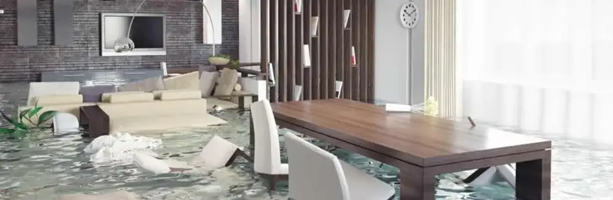 home interior affected by water damage with flooded floors and displaced furniture in Fort Collins, CO